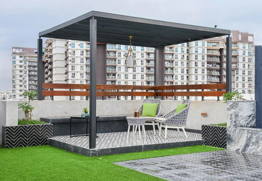 Residential terrace with a shaded outdoor seating area, Mustardd Spaces interior design portfolio