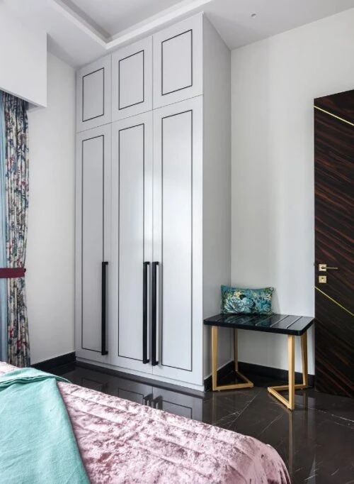 Bedroom wardrobe with paneled doors and a dressing table, Mustardd Spaces interior design portfolio