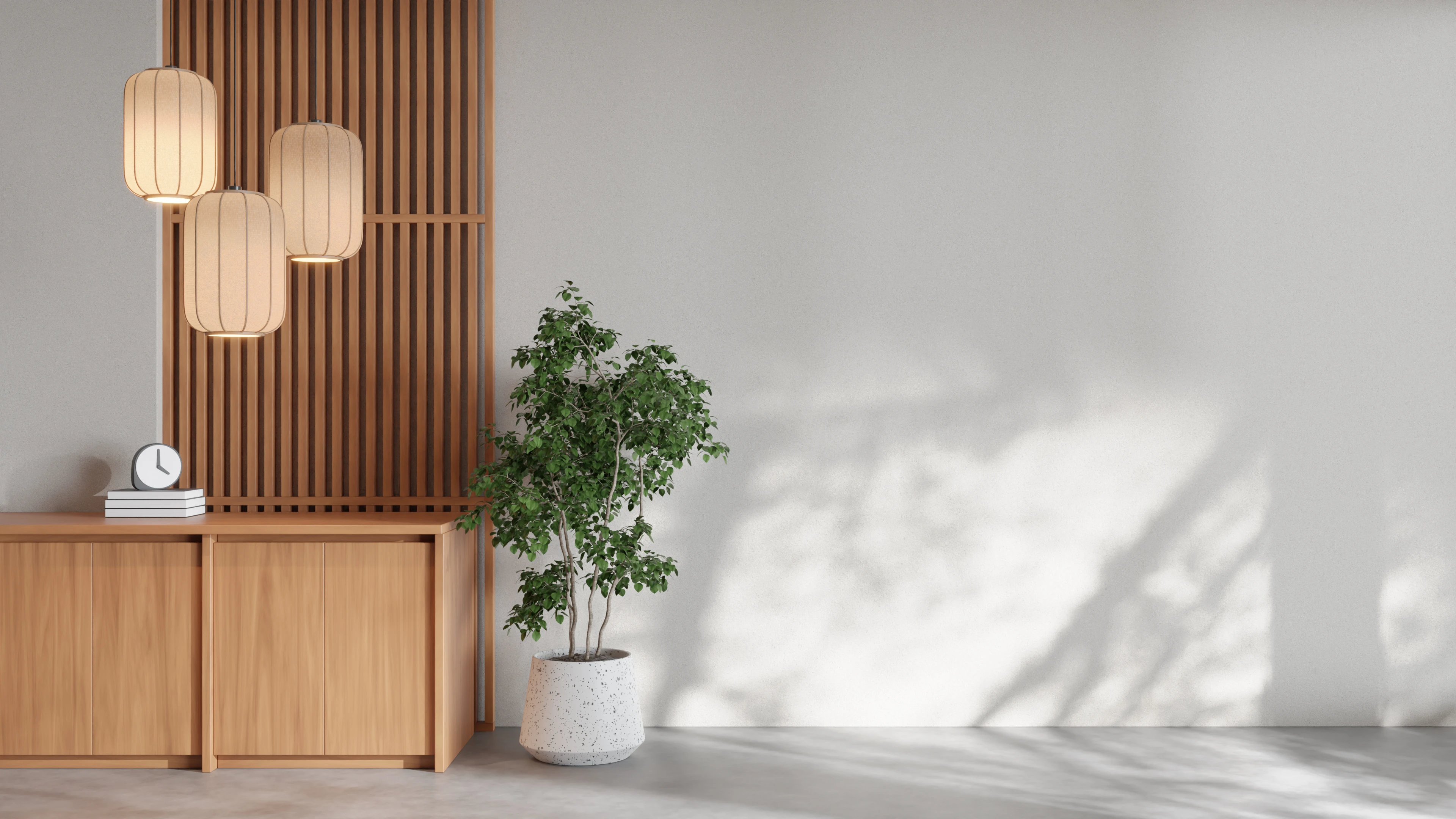 Timber sideboard and pendant lights beside a living-room wall, turnkey interior design in Bhilai and Raipur