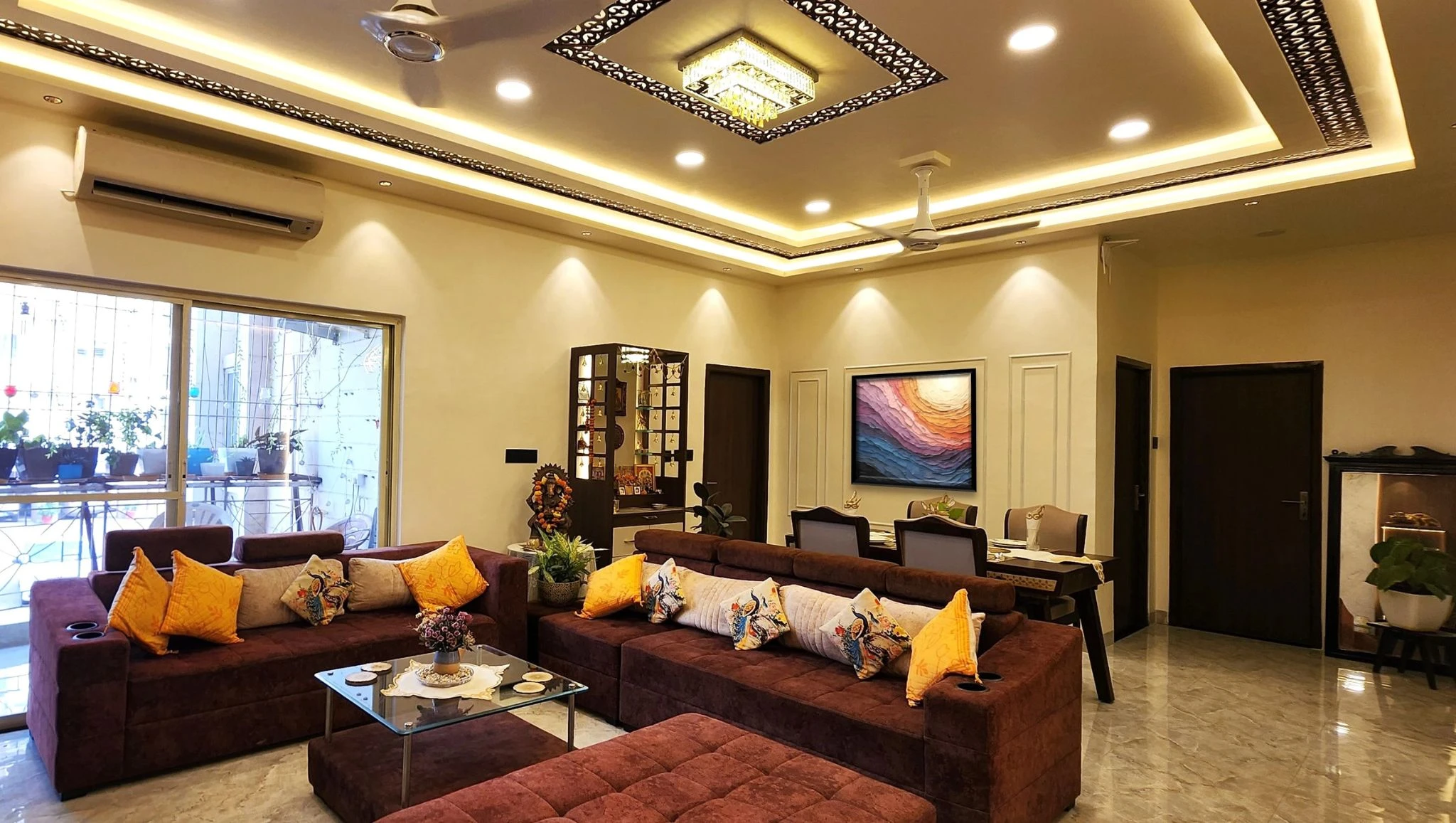 Living room with yellow cushions and recessed ceiling lights, interior design studio in Bhilai and Raipur