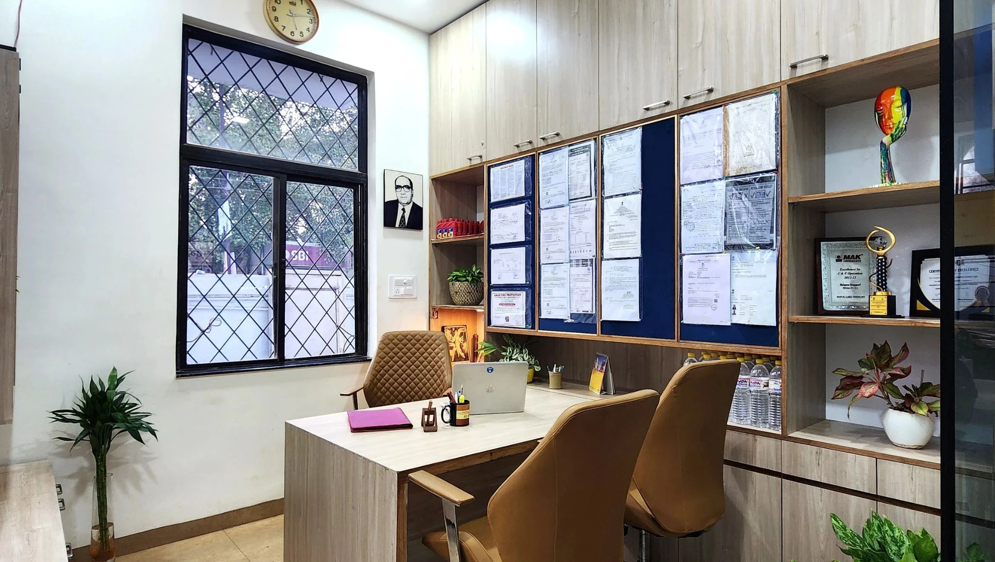 Compact office with a desk, guest chairs and display shelves, interior design studio in Bhilai and Raipur