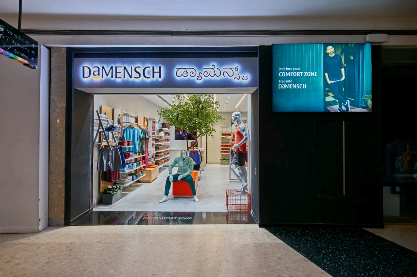 DaMensch clothing store entrance and illuminated signage, DaMensch retail interior design project in Bangalore by Mustardd Spaces