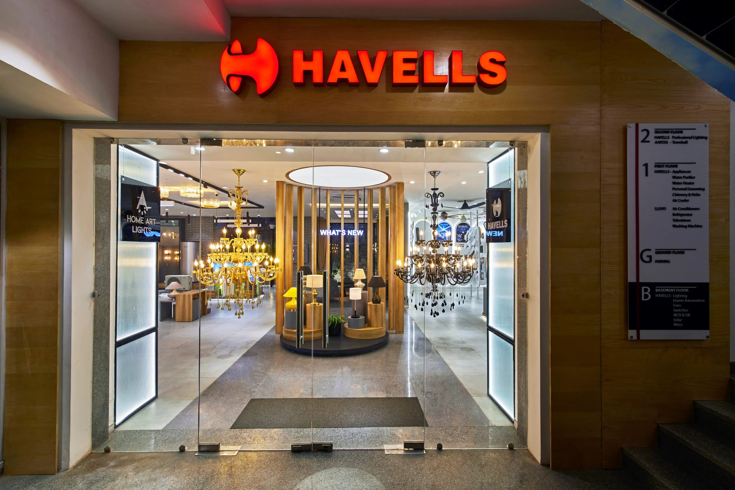 Havells showroom entrance and chandelier displays, Havells Experience Centre retail interior design project in Gurgaon by Mustardd Spaces