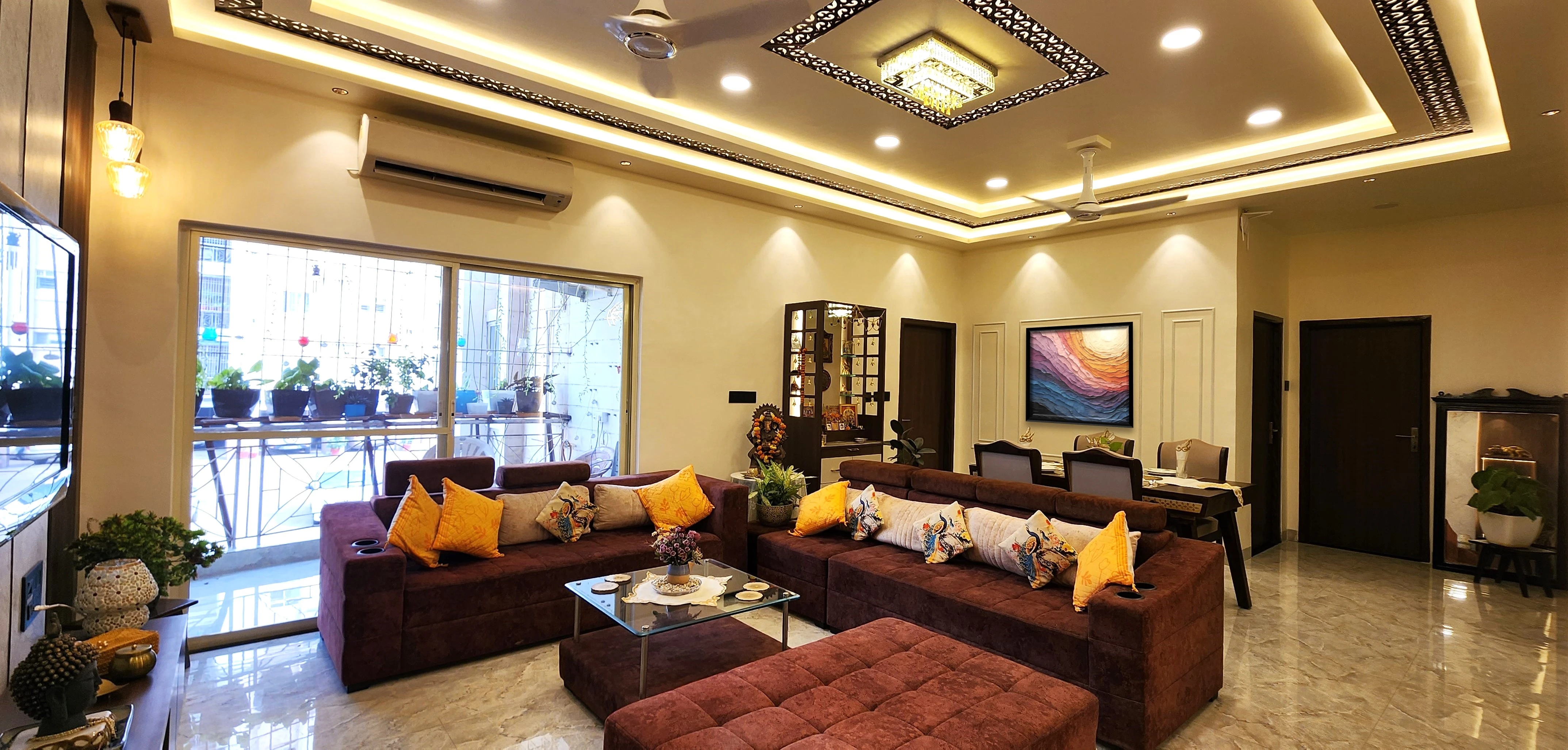 Living room with yellow cushions and recessed ceiling lights, Gulmohar 128 residential interior design in Bhilai by Mustardd Spaces