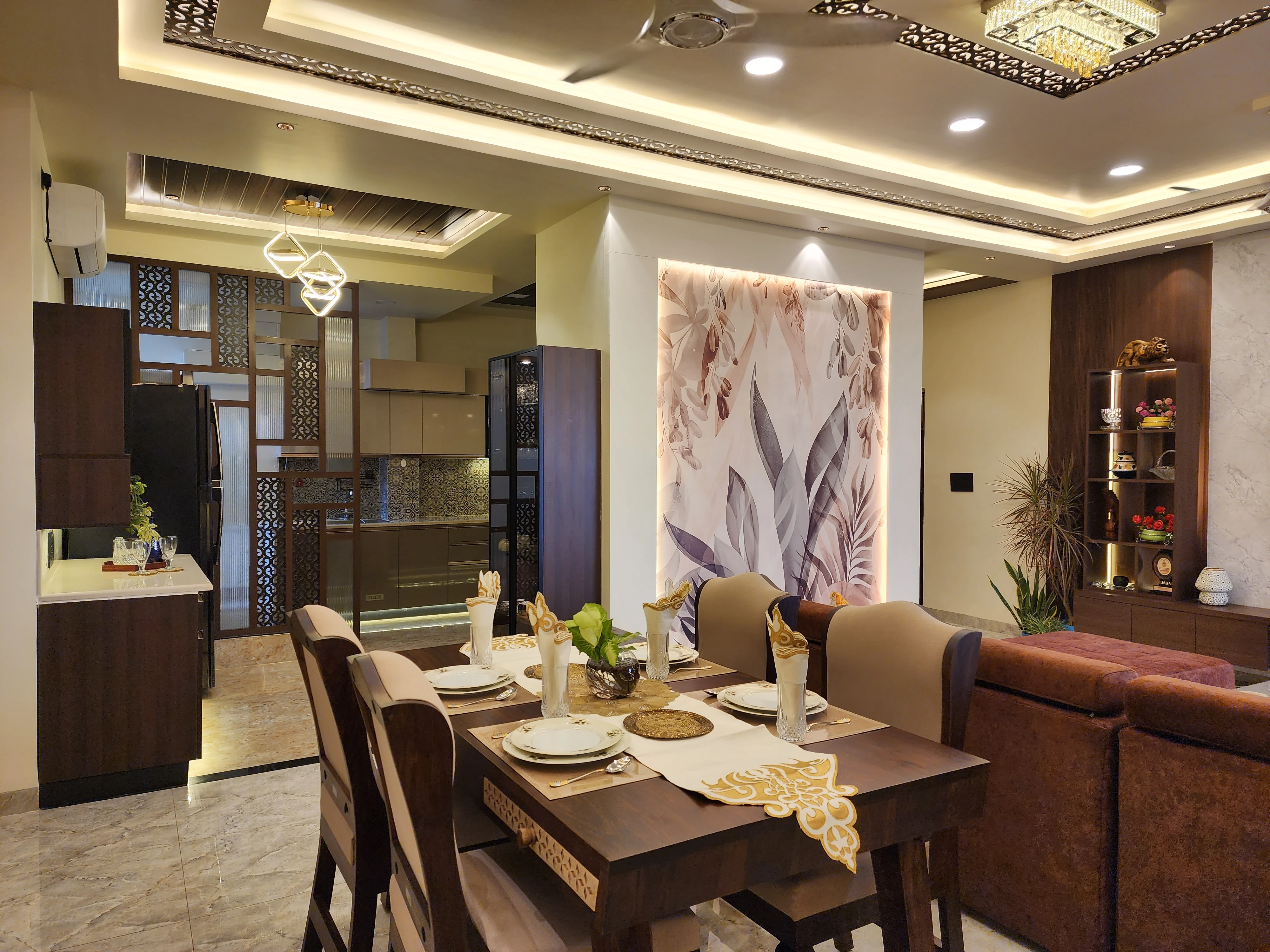 Dining room with upholstered chairs and a floral wall panel, Gulmohar 128 residential interior design in Bhilai by Mustardd Spaces