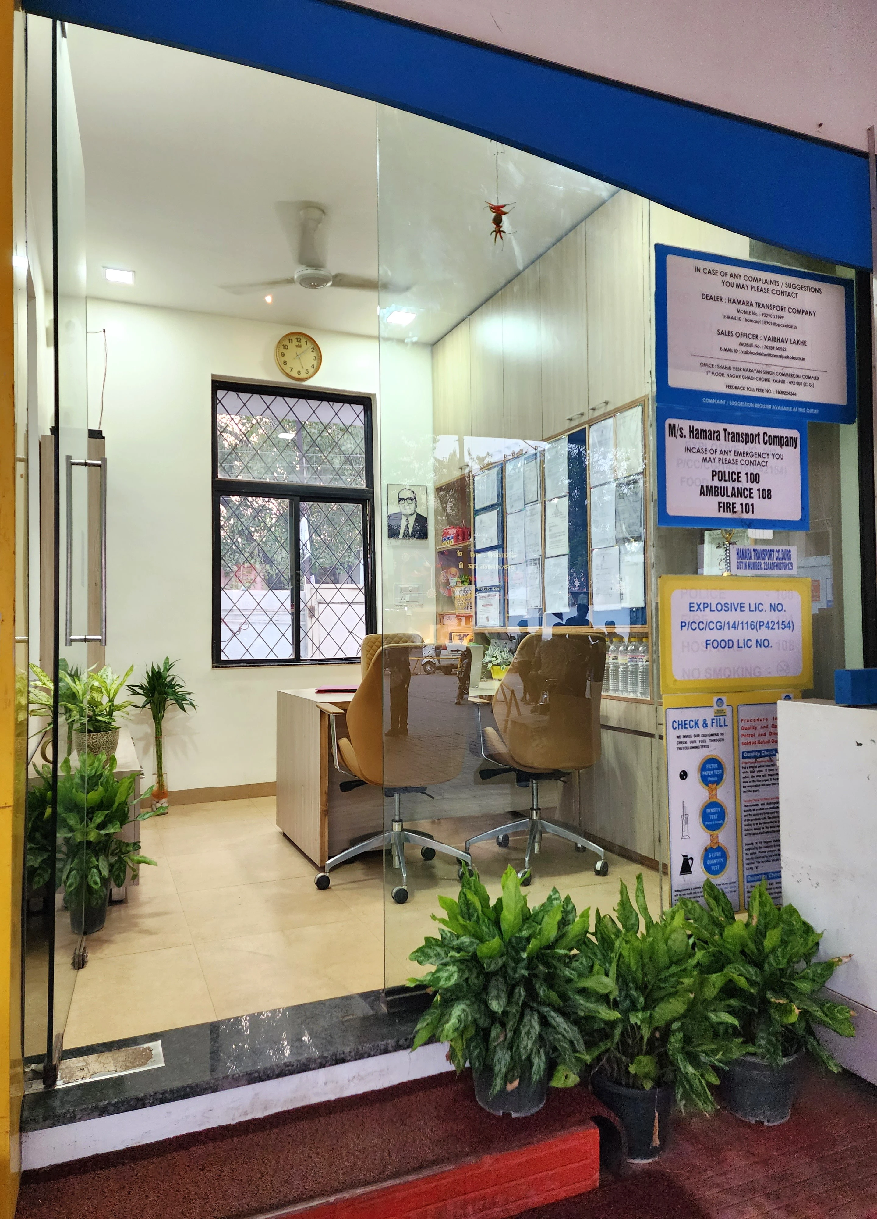 Glass-fronted office entrance with planted steps, The Office turnkey office interior design in Bhilai by Mustardd Spaces
